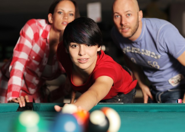 Students play pool