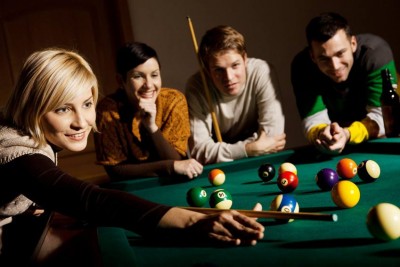 women-play-pool-group